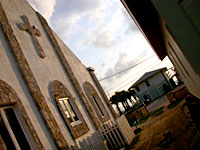 To the left: St. Mary Magdelene's Anglican Church, to the right: our building, straight ahead: the sea.